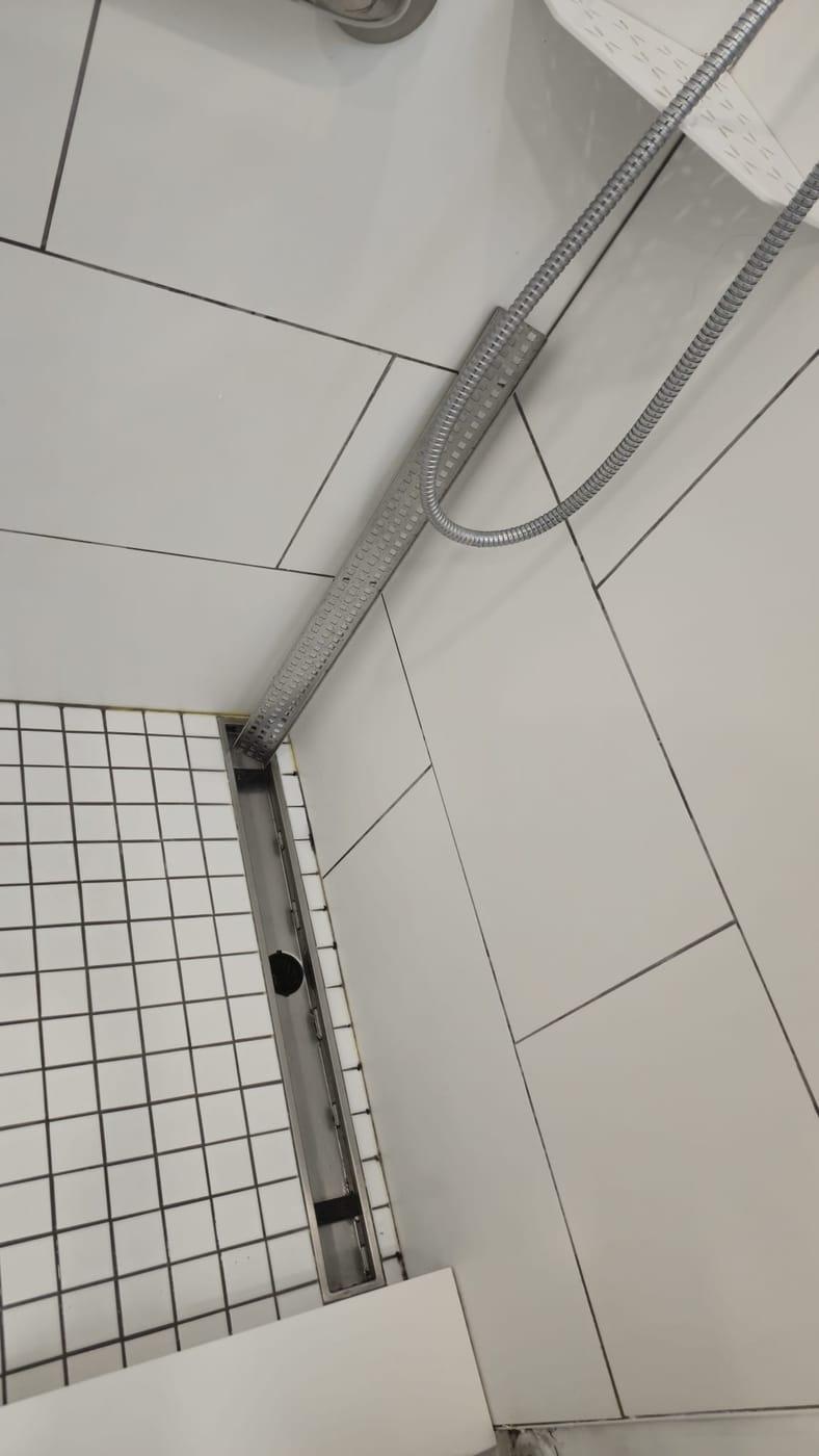 Clean shower tiles and linear drain